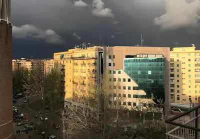 a view of a building in a city at Casa Vacanze Mafalda - Roma Stazione Trastevere in Rome