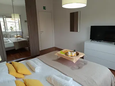 a living room with a couch and a table at Casa Vacanze Mafalda - Roma Stazione Trastevere in Rome