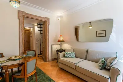 a living room with a couch and a table at Frattina Apartments in Rome