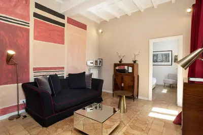 a living room with a couch and a table at Gambero Apartments in Rome