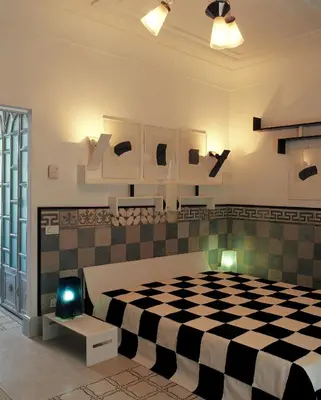 a bedroom with a black and white checkered bed at Villa Laetitia in Rome