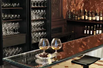 two wine glasses sitting on a counter in a bar at Villa Laetitia in Rome