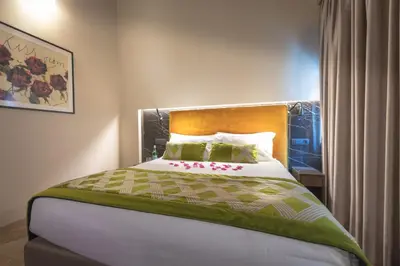 a bedroom with a large bed with flowers on it at NEMAN Maison Experience I Pantheon in Rome