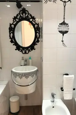 a bathroom with a sink and a mirror at Domus Caecilia - via Cola di Rienzo in Rome