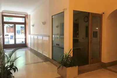 a room with a hallway with a door and some plants at Domus Caecilia - via Cola di Rienzo in Rome