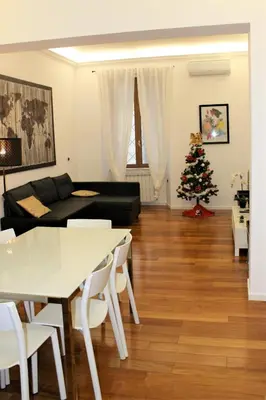 a living room with a christmas tree and a couch at Domus Caecilia - via Cola di Rienzo in Rome