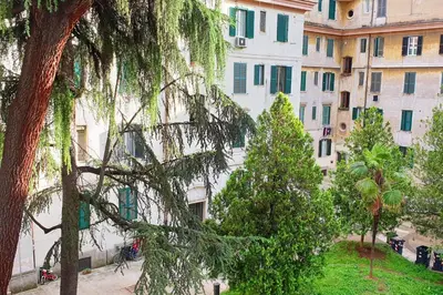 a tree in front of a large building at Casa Ferrari Testaccio e Trastevere Wi-Fi free in Rome