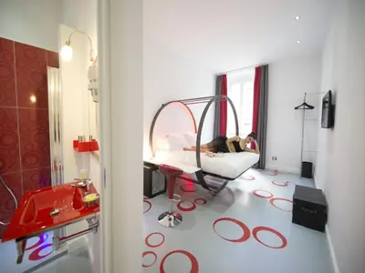 a hospital room with a patient laying on a bed at 7 Inn Spanish Steps in Rome