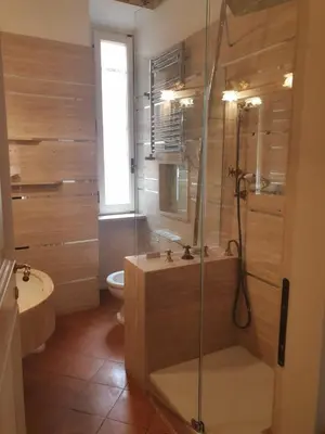 a bathroom with a shower and a sink and a toilet at Colosseo Smart Flat in Rome