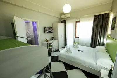 a hotel room with a bed and a window at Star of Rome in Rome