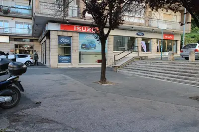 a motorcycle parked in front of a building at Star of Rome in Rome