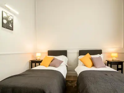 two beds sitting next to each other in a room at Holidays Suites Navona in Rome