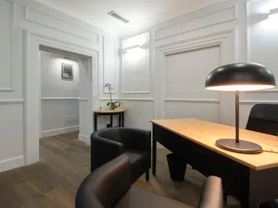 a room with a table and chairs and a lamp at Holidays Suites Navona in Rome