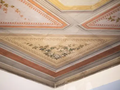 a coffered ceiling with flowers on it at Gemini Suites Navona in Rome