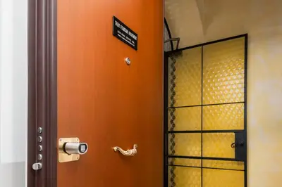 a bathroom with a shower with a toilet paper dispenser at Trevi Fountain Apartment - ZENO 03 in Rome
