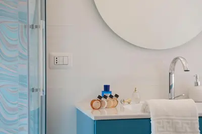 a bathroom with a sink and a mirror at St.Peter's Eden in Rome