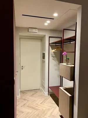 a hallway with a door leading into a room at Florea Palace in Rome