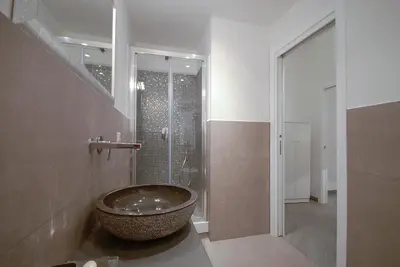 a bathroom with a large bowl sink in a shower at Easydomus Rome in Rome