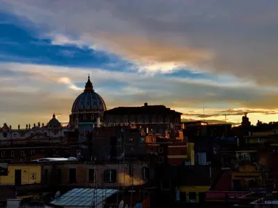 a view of a city with a domed building at Art Atelier Vaticano Guest House in Rome