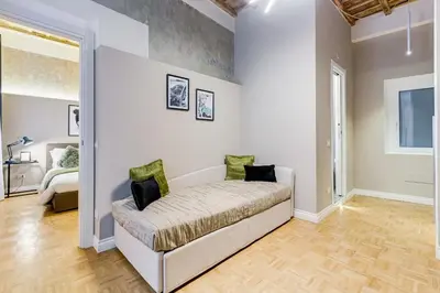 a bedroom with a bed in a room at Tankara Suite in Rome