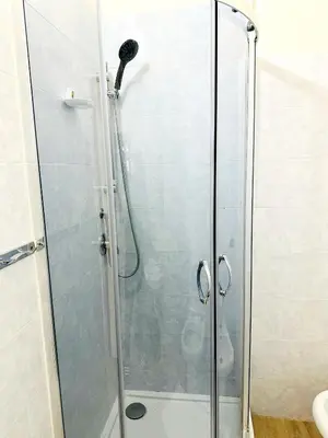 a shower with a glass door in a bathroom at welcome Termini in Rome