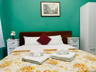 a bedroom with a bed with two towels on it at welcome Termini in Rome
