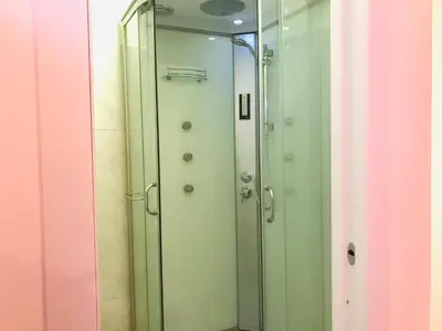 a glass shower door with a mirror in a bathroom at welcome Termini in Rome