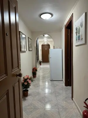 a hallway with a white refrigerator in a room at welcome Termini in Rome