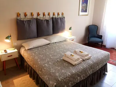 a bedroom with a bed with two towels on it at Interno Otto in Rome