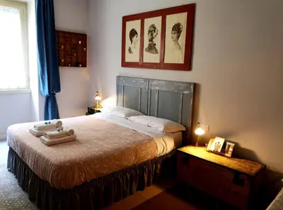 a bedroom with a bed with two towels on it at Interno Otto in Rome