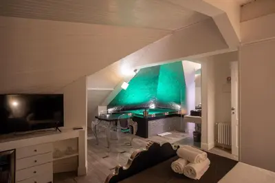 a living room with a couch and a piano at SuiteFrattini Private Spa in Rome
