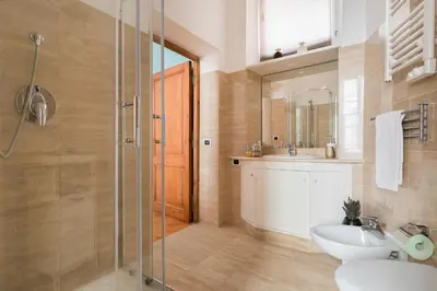 a bathroom with a sink and a toilet and a shower at VENETO AVENUE in Rome