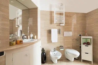 a bathroom with a sink and a toilet and a mirror at VENETO AVENUE in Rome