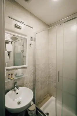 a bathroom with a sink and a shower at Walker Rooms in Rome