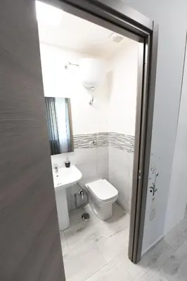 a bathroom with a toilet and a sink at AFFITTACAMERE A CASA MIA in Rome
