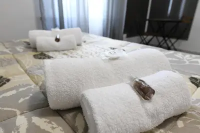 a couple of towels on top of a bed at AFFITTACAMERE A CASA MIA in Rome