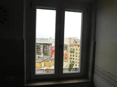 a window with three views of a city at My House in Rome in Rome