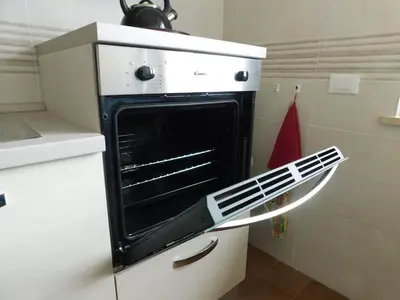 an oven with its door open in a kitchen at My House in Rome in Rome