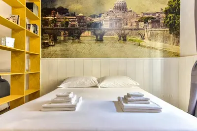 a bedroom with a bed with towels on it at Trastevere Queen in Rome
