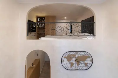 a room with a bed and a world sign on the wall at POPOLO PEN 56 Apartament in Rome