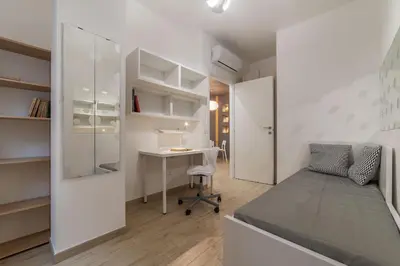 a room with a desk and a chair and a table at Appartamenti Clivo di Monte del Gallo in Rome