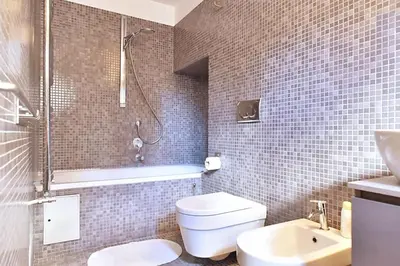 a bathroom with a shower and a toilet and a sink at Delizioso appartamento a Campo de' Fiori in Rome