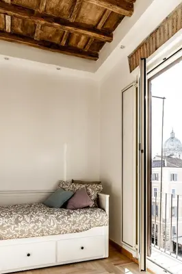 a bedroom with a bed and a large window at Campo24roma Guesthouse in Rome