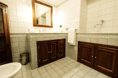 a bathroom with a sink and a toilet and a mirror at Magna Domus in Rome