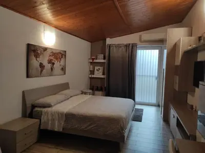 a bedroom with a bed and a television in it at Amazing Appia Antica - Campidoglio in Rome
