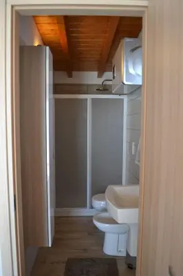 a bathroom with two toilets and a sink at Amazing Appia Antica - Campidoglio in Rome