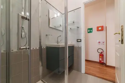 a bathroom with a shower and a sink at Augustus Suite near Saint Peter in Rome