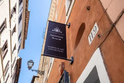 a sign on the side of a building at Maison d'Art Apartments - Maison d'Art Collection in Rome