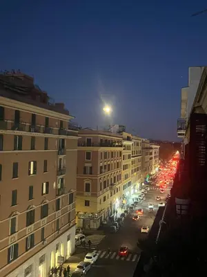 a view of a city street at night with cars at House Candia 111 - Vatican Museum apartment in Rome