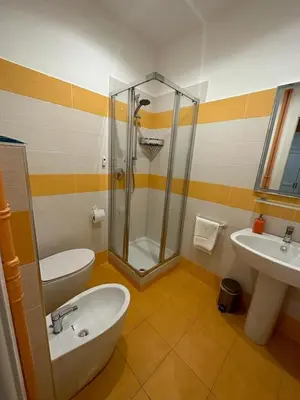 a bathroom with a shower and a toilet and a sink at B&B Una notte a Mazzini in Rome